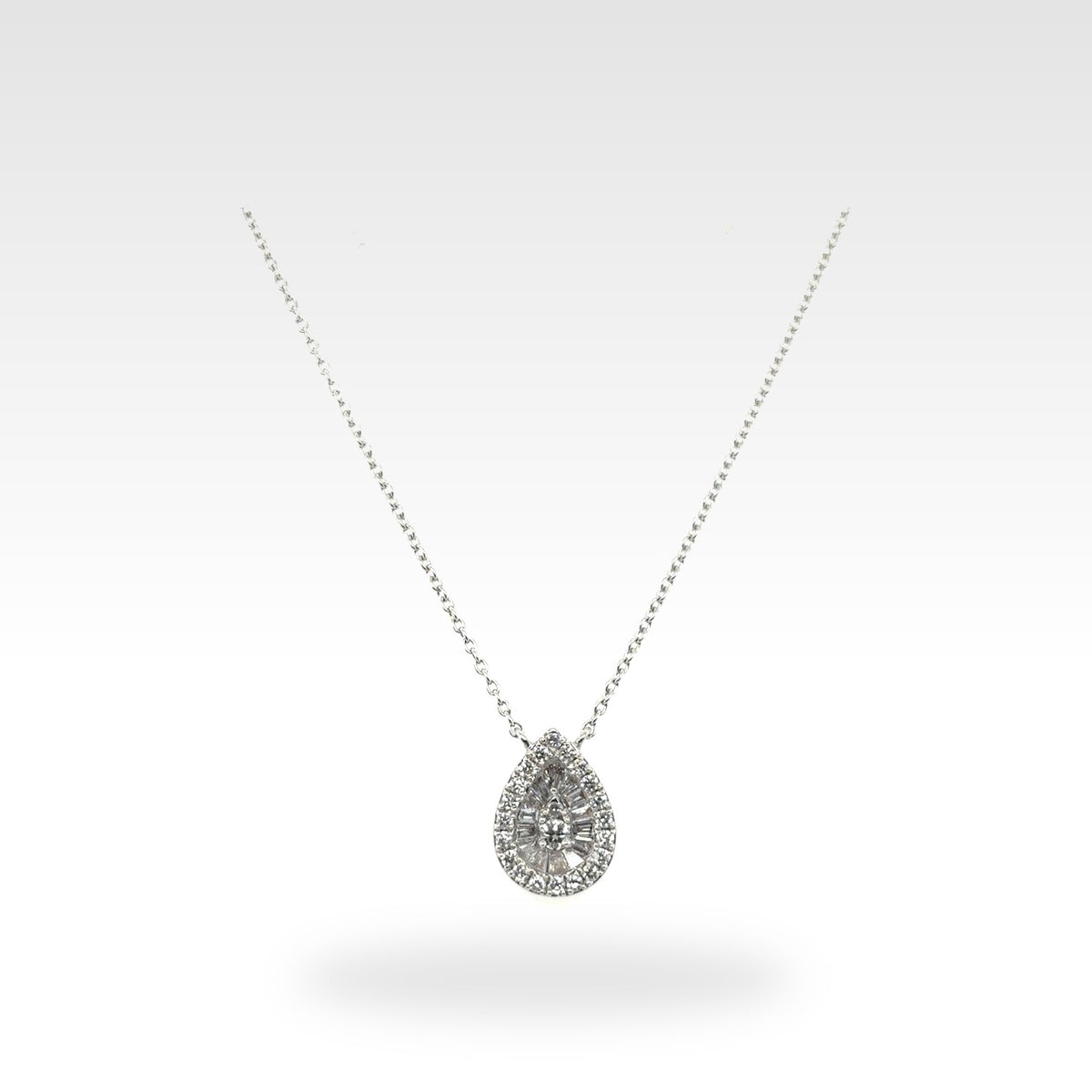 Baguette Pear Shaped Cluster Pendant in 18ct white gold with round natural diamonds