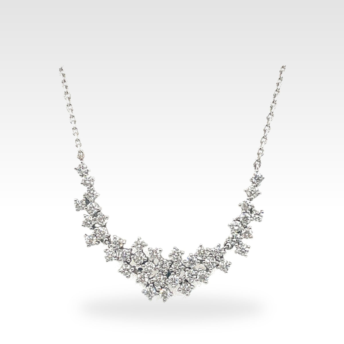 Floral Cluster Necklace in 18ct white gold with round diamonds