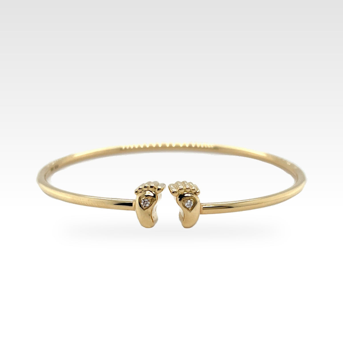Baby Bangle (Feet) in yellow gold with round diamonds